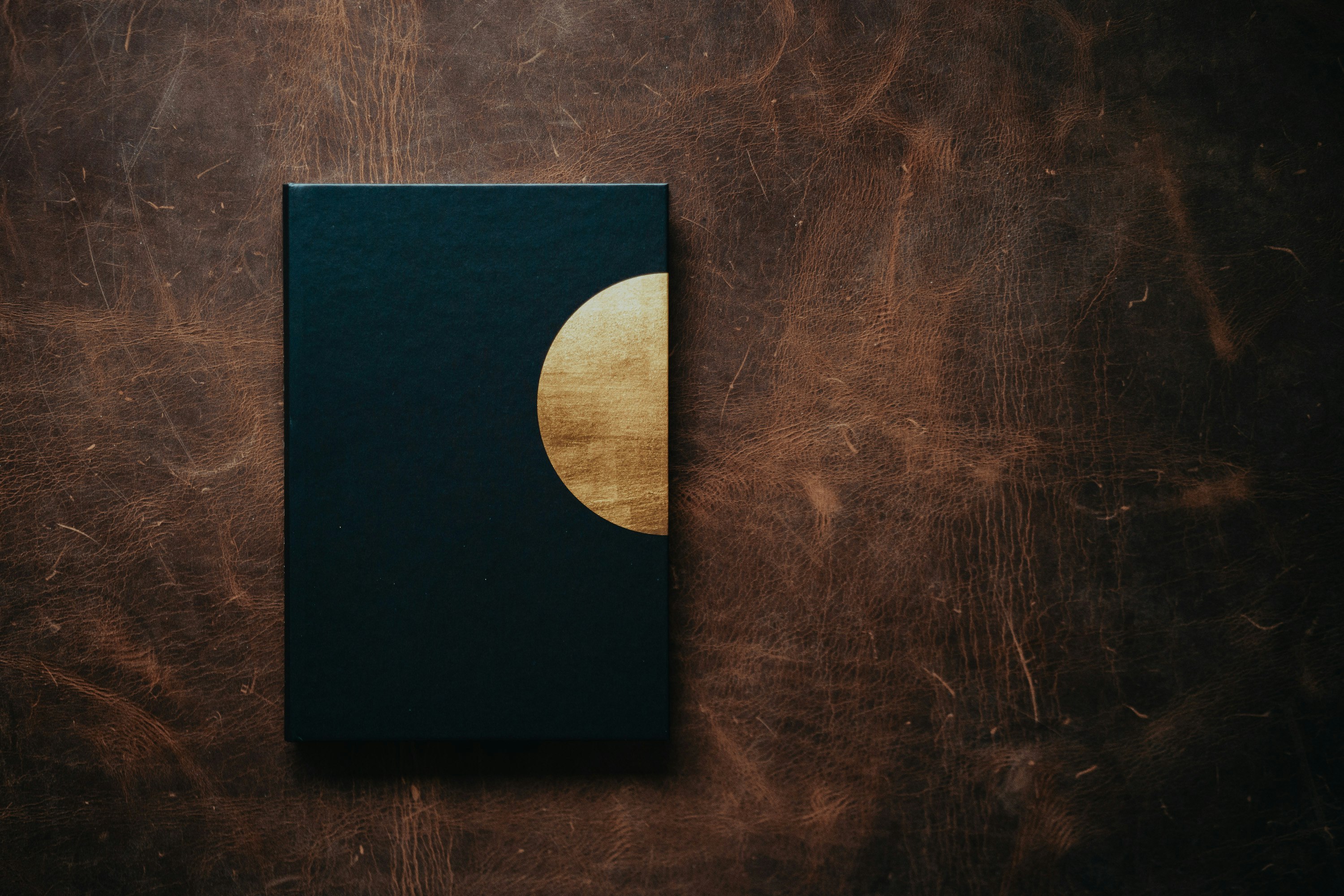 black square box on brown wooden table